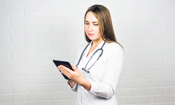 stina healthcare solutions portrait of a nurse using a digital tablet